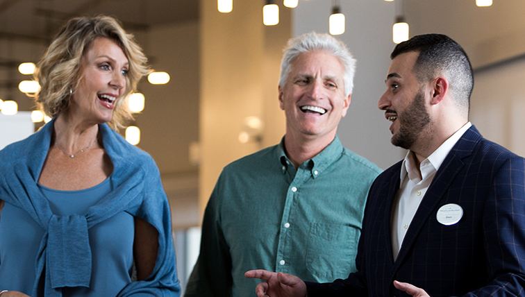 Sales team member showing a property to potential owners